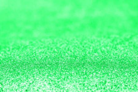 Abstract green glitter blurred holiday texture.の写真素材