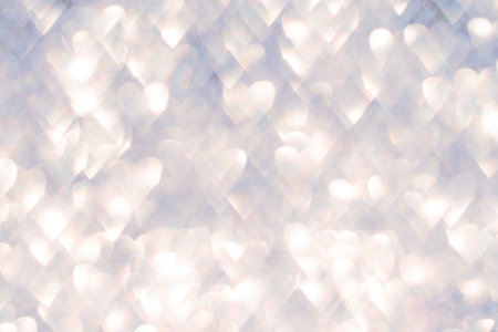Soft glowing bokeh effect with heart shapes creating a dreamy background