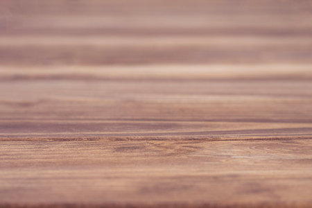 Close-up of a natural wood surface with visible grains and textureの写真素材