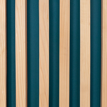 Decorative wooden slats with teal background forming a stylish modern interior design