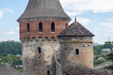 Kamianets-Podilskyi, June 1, 2024. Historic castle tower with distinct architecture in a scenic landscape viewの写真素材