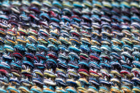 Closeup of vibrant multicolored woven textile with intricate texture and detailsの写真素材