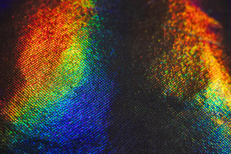 Vibrant spectrum reflections on textured surface in dynamic abstract compositionの写真素材