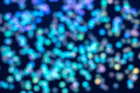 Vibrant bokeh lights create an abstract colorful background for creative projects and design