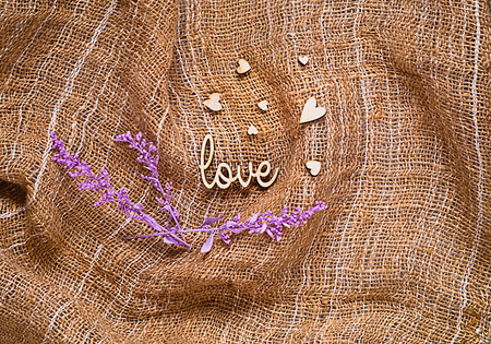 The texture of burlap with hearts with ultraviolet decoration, holiday concept and romantic backgroundの写真素材