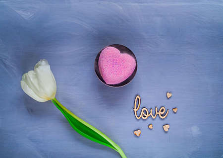 dessert  and a white tulip on a dark background, top view, space for text,holiday conceptの写真素材