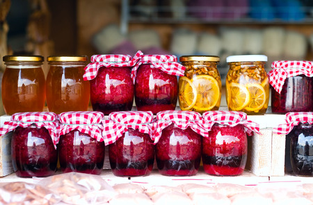 honey, jam, confiture, jam from ecological mountain herbs and fruits in glass jars, the concept of natural products, a choice of healthy nutrition for the heart, close-up, a copy of the spaceの写真素材