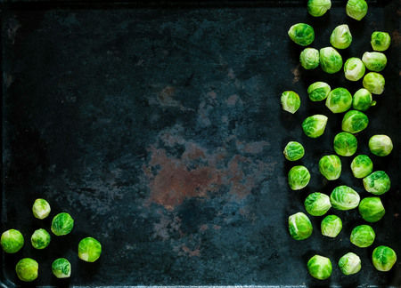 fresh brussels sprouts  on vintage rusty metal background, vegetables for healthy cooking, flat lay,copy space, closeup. Diet, pure food or the concept of vegetarian foodの写真素材