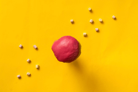 colored glazed donut and marshmallow fall or fly in motion against a pink and yellow pastel background. Concept of food, colorful breakfast. Macro concept,closeup, copy spaceの写真素材