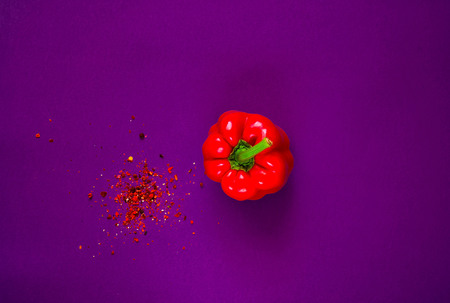 Spices and Creative  red pepper on purple background.Frame of organic food. The concept of vegetarian food and healthy diet, copy space, closeup,banner.の写真素材