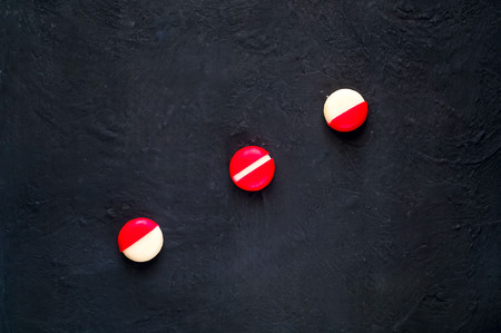 small round cheese in paraffin pack on dark blue background, top view, organic food concept.Flat lay.copy spaceの写真素材