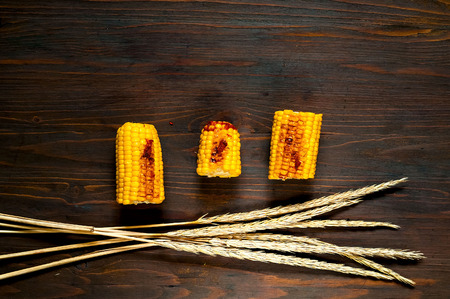 Hot grilled  Corn from BBQ on a wooden background.の写真素材