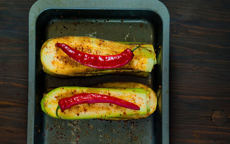Eggplant and zucchini for grilling on iron baking tray, isolated.Banner. The concept of healthy eating and delicious food.Top view, copy space, flat lay,closeupの写真素材