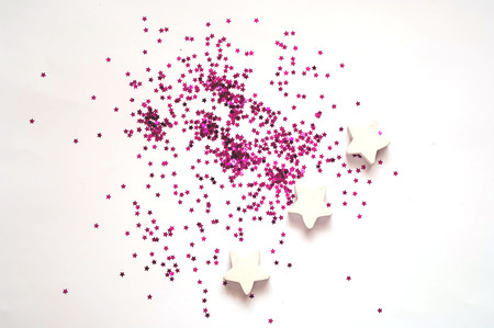 Festive decorations.  Wooden and purple stars on white backgroundの写真素材