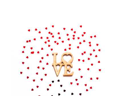 Festive white background with red spangles in the shape of heart. Concept Valentines Day. Closeup, copy space.の写真素材