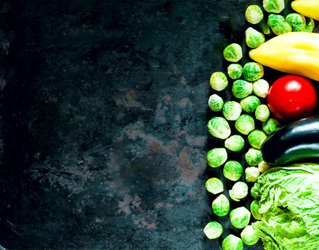 Fresh vegetables for healthy cooking on background of old rusty metals. Pure food or the concept of vegetarian food.Top view. Copy space, closeup.の写真素材