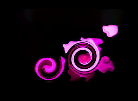 Abstract black background with swirling purple lines. Closeup, copy spaceの写真素材
