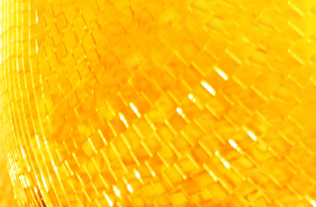 Golden sparkling background with blur effect. Closeup. Festive concept.の写真素材