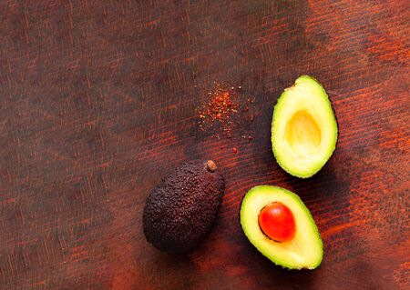 Avocado ready to eat on wooden background. Healthy eating concept. Close-up, copy spaceの写真素材