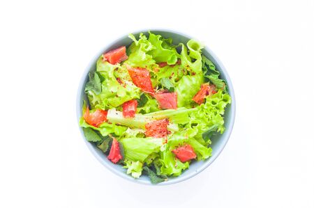 Salmon  Poke Salad on white isolated background. The concept of healthy eating. Close-up, copy spaceの写真素材