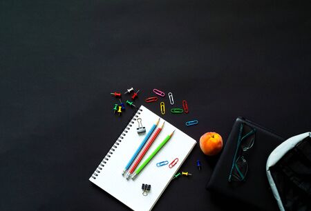 Back to school. School supplies on black background.Close-up, copy space