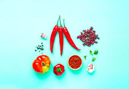 Ingredients for making spicy soup with beans on a green background. Mexican food concept. Close-up, copy spaceの写真素材