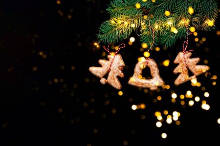 Homemade christmas gingerbread cookies on black background. Copy spaceの写真素材