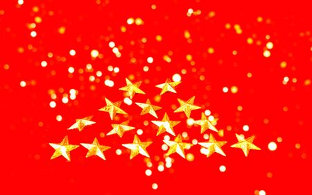 Festive red background with gold stars.Concept for festive background or for project. Copy space, close-upの写真素材