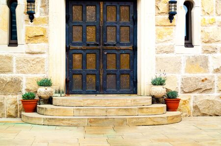 Old stone house with garden flowers. Happiness is in small things. Closeupの写真素材