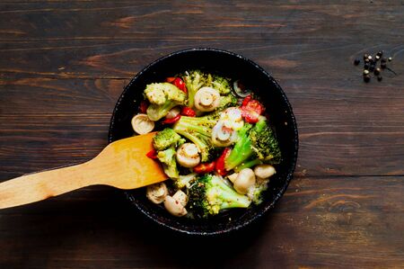 Mushroom-Vegetable Blends in authentic pan on wooden background. Cooking delicious food at home. Close-up, creative copy spaceの写真素材