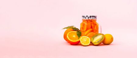 Homemade drink mit tropical fruit or cocktail on pink background. The concept of popular drinks. Close-up, copy space.の写真素材