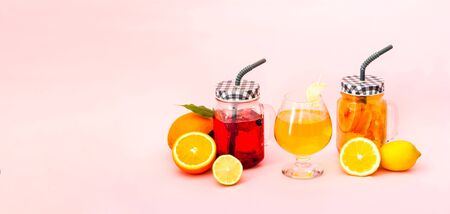 Quarantini or homemade alcohol drink and tropical fruit cocktails on pink background. The concept of...