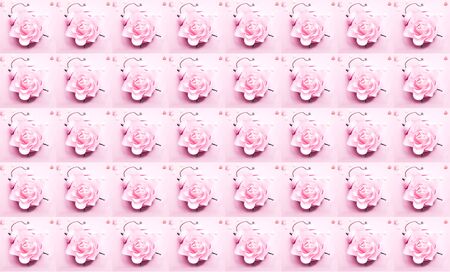 Festive concept with alarm clock and roses flower on pink background. Creative copy spaceの写真素材