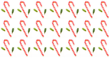 Christmas or New Year pattern of caramel cane and fir branches on white background. Design for...