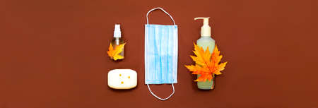 Respiratory protective face mask, sanitizer gel and soap for hand hygiene coronavirus protection on beige background. Coronavirus prevention.の写真素材