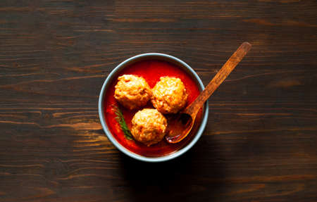 Meat balls in tomato sauce on wooden background.Close-upの写真素材