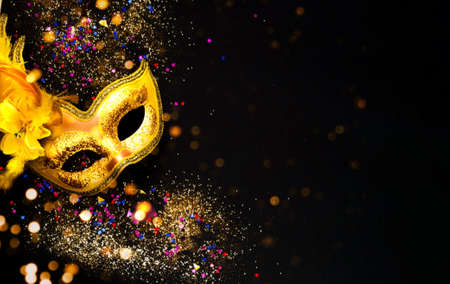Masquerade mask on dark background with sparkles. The concept of traditional holidays.の写真素材