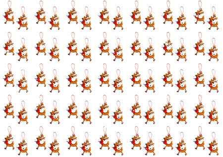 Pattern with christmas wooden deer on white background. Creative copy space for design and wrapping paper.の写真素材