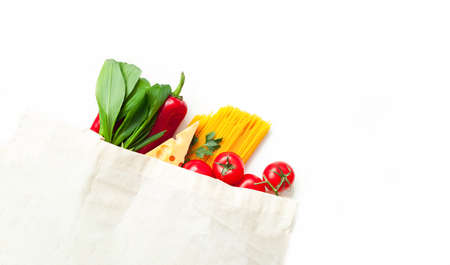 Eco bag with vegetables and spaghetti on white background. Ingredients for cooking. Close-upの写真素材