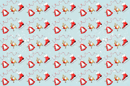 Pattern of Christmas wooden figurines on gray background. Festive concept for gift wrapping paper...