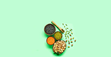 Organic ingredients for Flexitarianism or Flexible Vegetarianism on green background. Healthy eating concept. Creative copy space. Close-upの写真素材