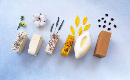 Organic natural set of calendula, lavender, natural and herbal of soap on light colors background. Handmade organic soap concept from natural ingredients. Close-upの写真素材