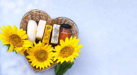 Handmade soap in straw basket made in the shape of heart against a background of light colors. Handmade organic soap concept from natural ingredients. Close-upの写真素材