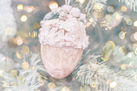 Christmas ball or toy on blurred background with sparkles. Christmas decor and home decoration for the New Year. Atmospheric mood in trendy colors of the Year 2023. Close-upの写真素材