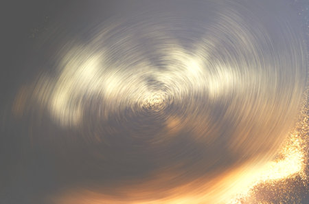 Abstract dark background with golden sparkles in motion. Bright colors for seasonal projects and...