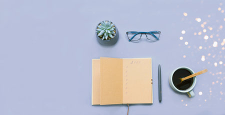 Goals in notebook for 2023 on wooden background with sparkles . Festive concept. Atmospheric mood in trendy colors of the New Year.の写真素材