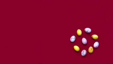 Colored chocolate eggs on Magenta background. Easter design concept in 2023 trendy colors. Close-upの写真素材