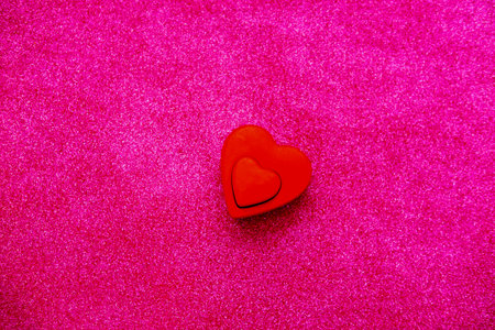 Red heart for Valentines Day on Magenta background with sparkles. Trendy Color of Year 2023の写真素材