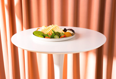 Traditional breakfast with bacon, avocado and toasts on white table. Healthy food concept. Close-up