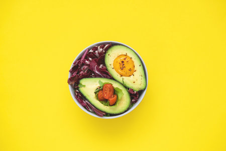 Baked egg with avocado. Bowl from healthy and balanced products. Fodmap diet concept. Homemade food.